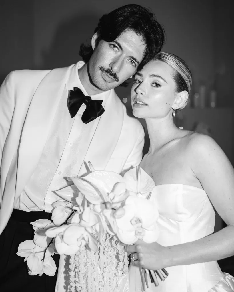 Bride and groom portrait at Fontsanta indoors with candlelit floral installations and a refined, modern atmosphere.