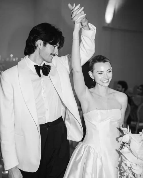 Black and white moment of the bride and groom celebrating together on the dance floor at Fontsanta.