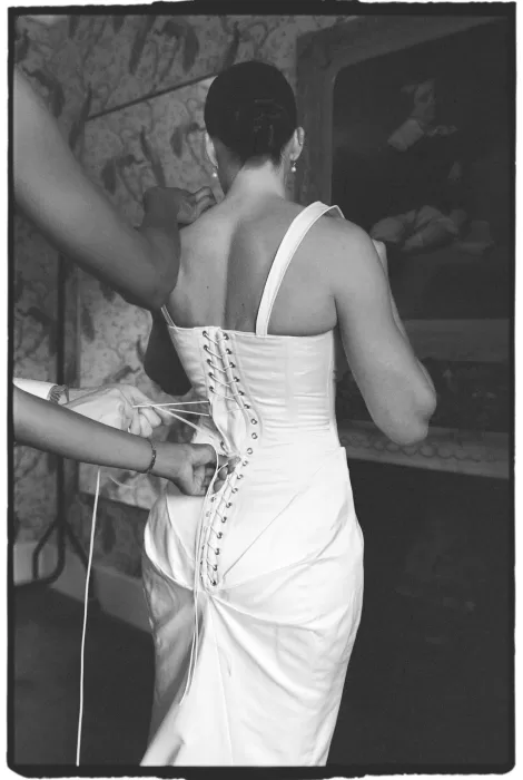 Bride having her wedding dress laced during morning preparations at Boturich Castle.