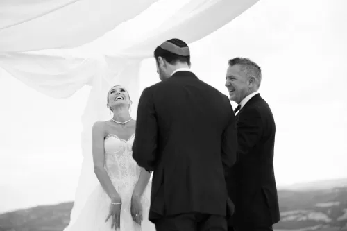 Bride laughing during heartfelt ceremony moment at Castello di Velona.