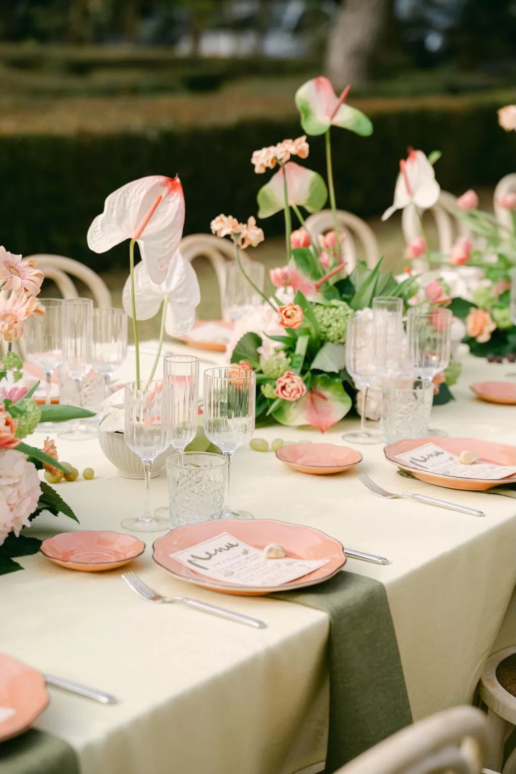 Garden wedding table styling at Fontsanta featuring pastel florals, soft linens and relaxed outdoor dining.