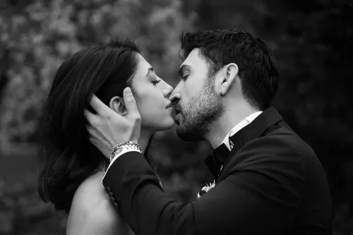 Black and white close-up of bride and groom sharing a quiet moment during their Villa Honegg wedding.