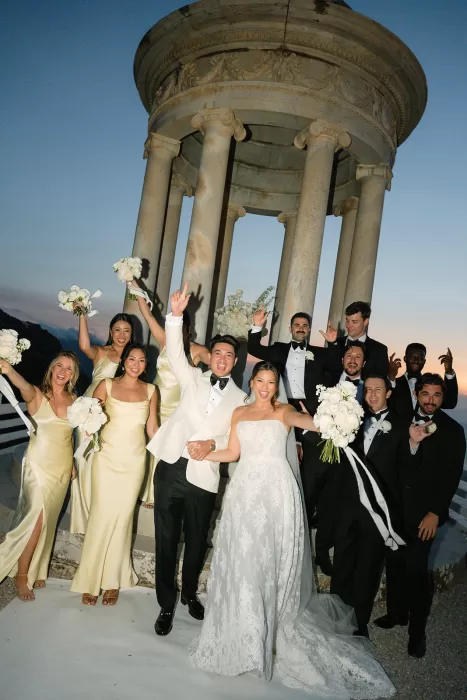 Wedding party celebrating in front of the temple at Son Marroig at sunset