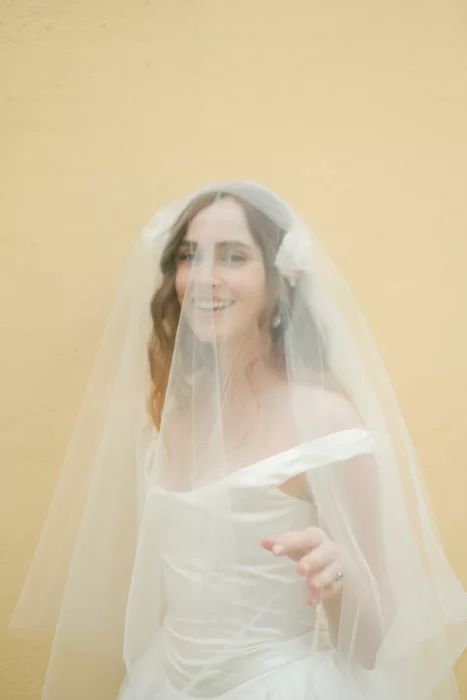 Artistic overlay of yellow flowers layered over soft bridal portrait at Finca Morneta