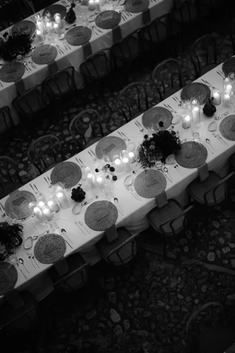 Candlelit reception tables arranged in rows for dinner at Finca Morneta
