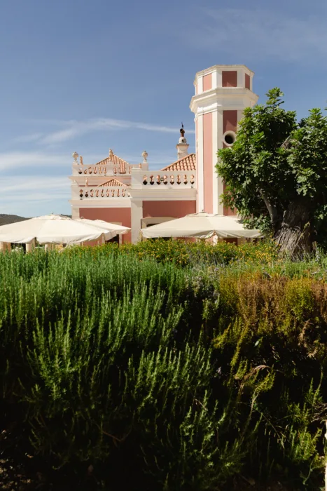 Pink façade and gardens at Pousada Palácio Estoi in the Algarve