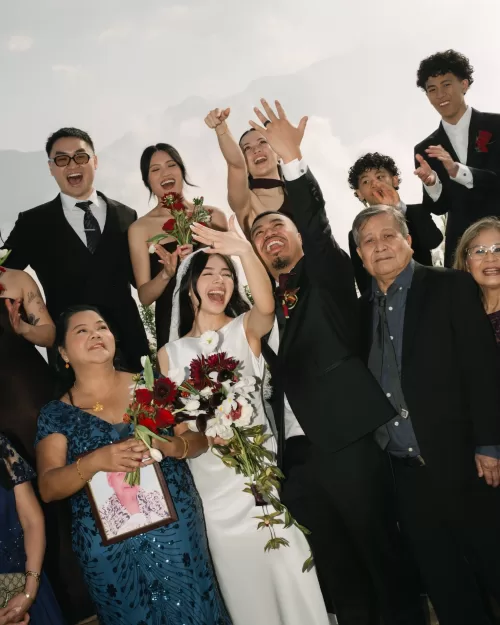 The couple celebrate with family and friends after exchanging rings on the mountain deck.