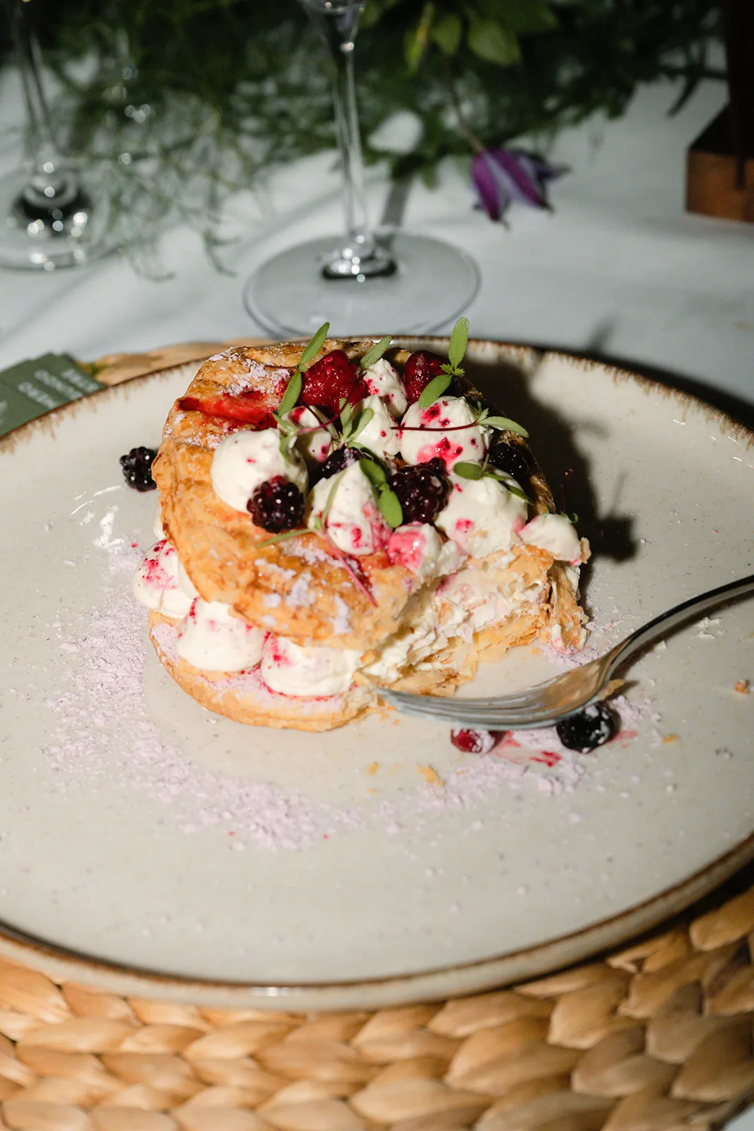 Plated pastry dessert with cream and berries served during reception at Finca Morneta